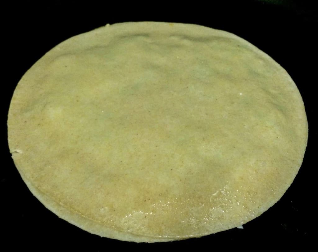 Cover with another tortilla and cook on stovetop