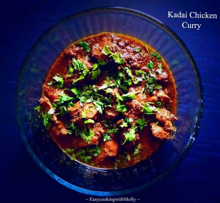 kadai chicken curry in a bowl with shopped cilantro on top
