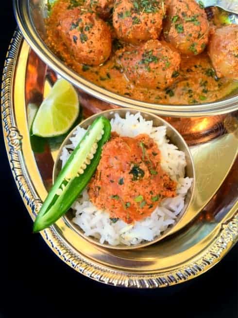 Kashmiri Dum Aloo in a platter with rice.