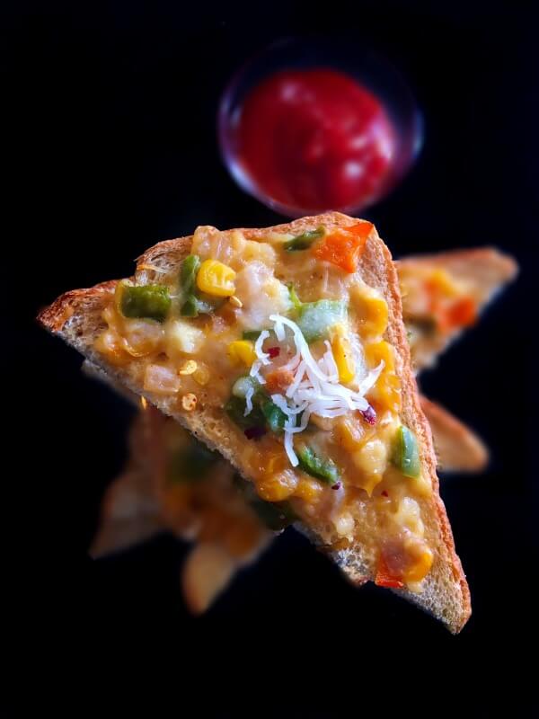 Indian cheese corn toast recipe and served with ketchup
