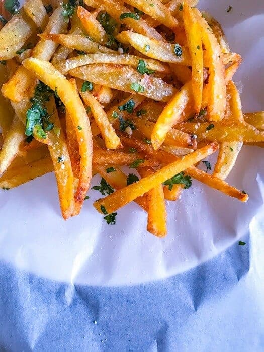 Homemade Garlic Fries on a white plate