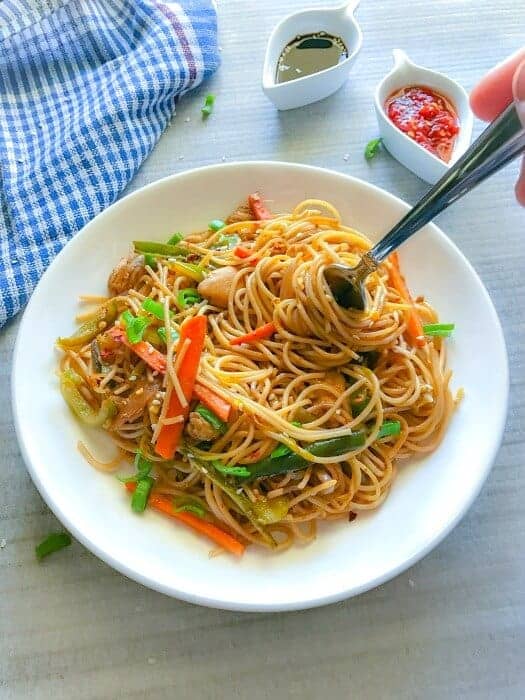 chinese chicken chowmein recipe on a plate with fork