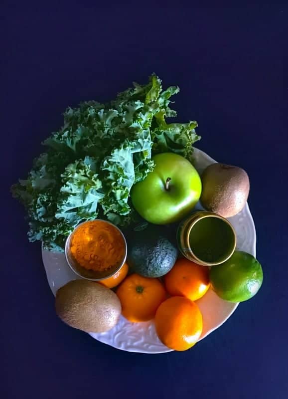 immunity boosting smoothie ingredients like apple, oranges, kiwi, avocado, turmeric