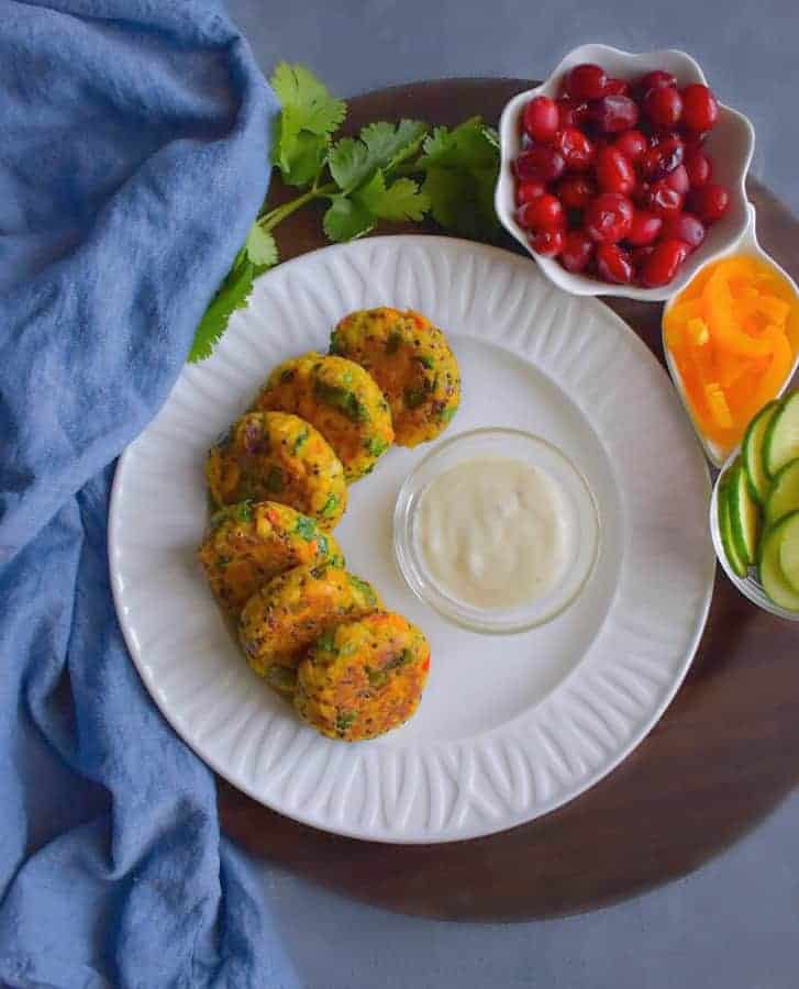 curried tuna patties on a white plate with blue napkin