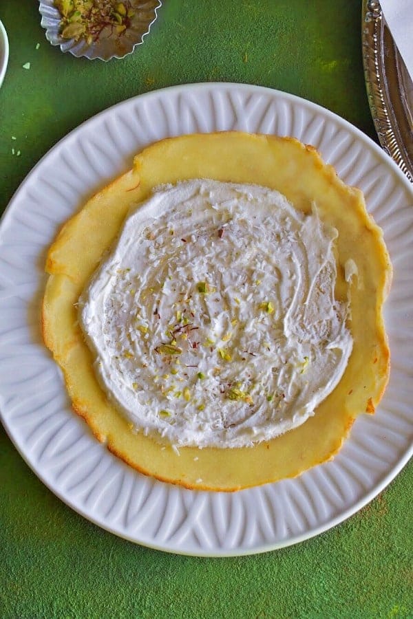cardamom saffrom cream filling on the indian crepe