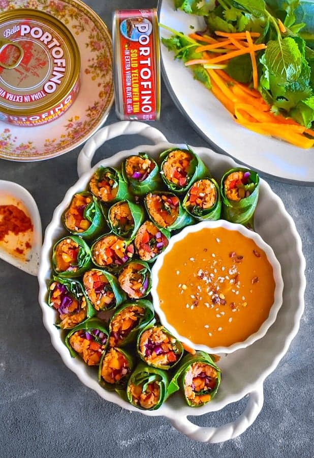 Thai Vegetable Tuna Rolls in a white bowl with peanut sauce