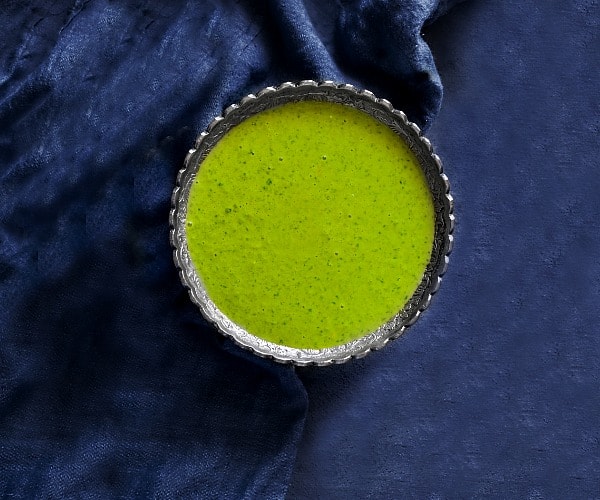 cilantro green chutney recipe on a blue board with blue napkin