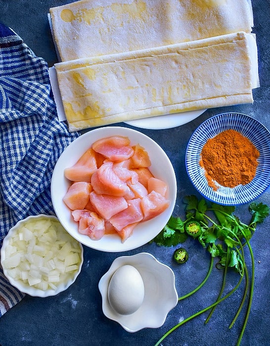 Indian Chicken Puff Ingredients on a blue background