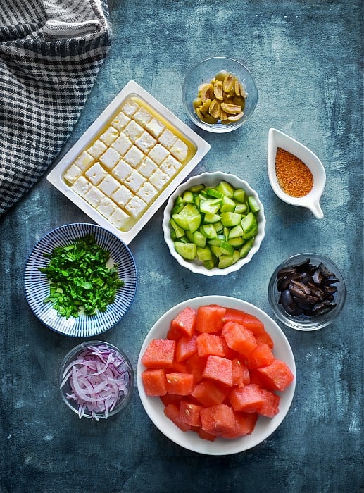 Greek Watermelon Salad ingredients like feta, cucumber, onions
