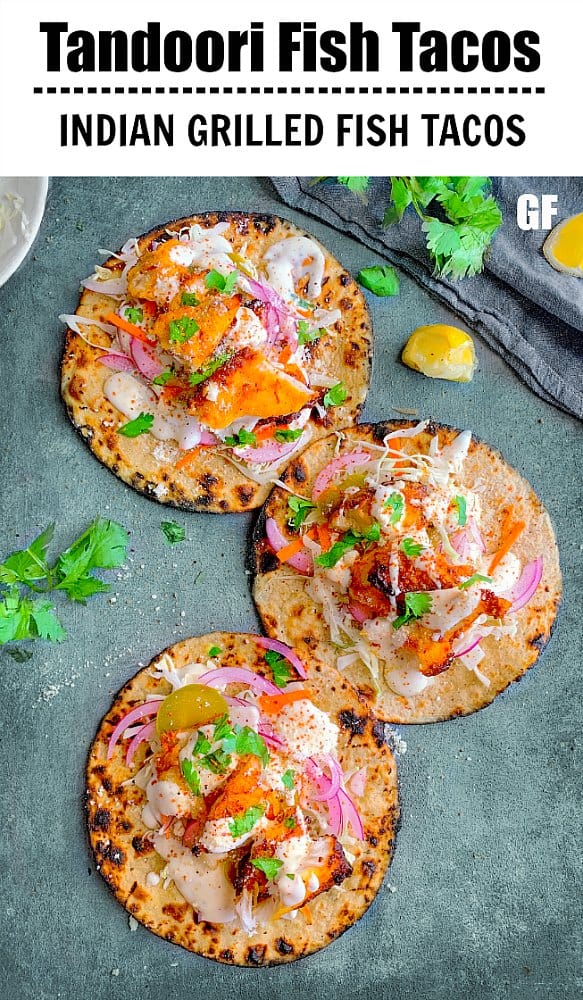 Tandoori Fish Tacos topped with pickled onions, yogurt sauce and cabbage
