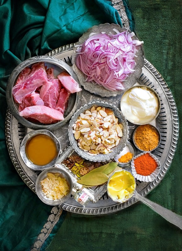 Mutton Korma Ingredients on a silver plate.