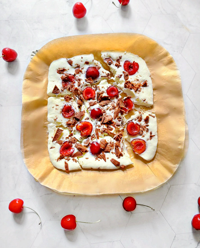 sugar free chocolate yogurt bark on a parchment paper.